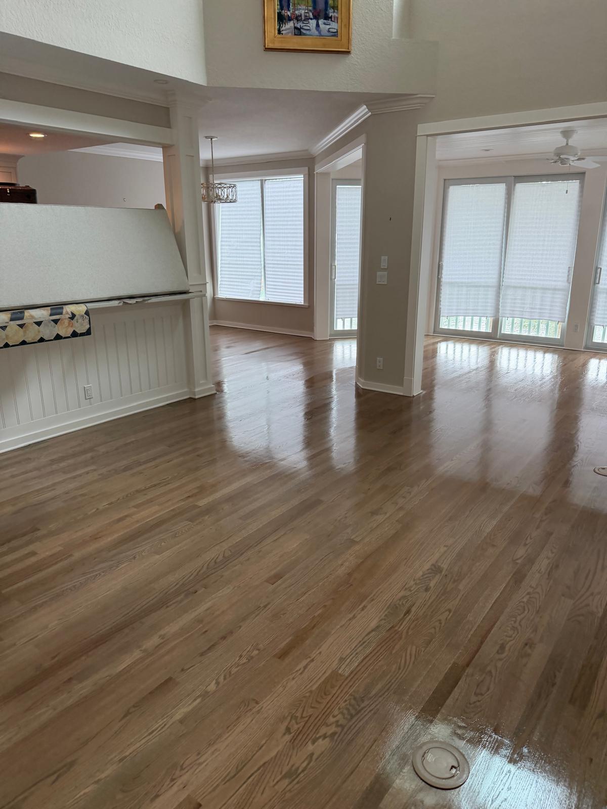 Same hardwood floor after professional staining and finishing