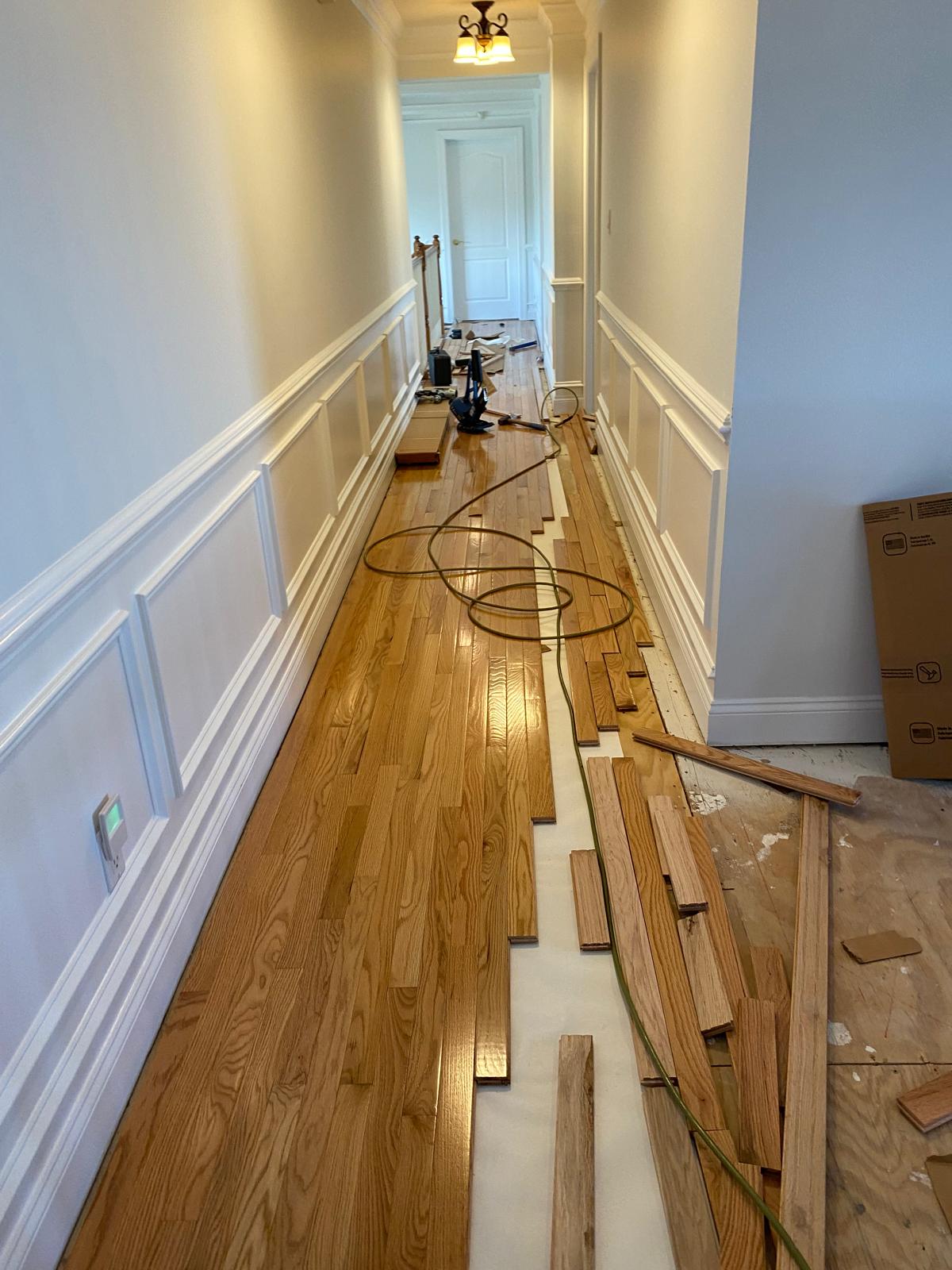 Professional hardwood floor installation in progress